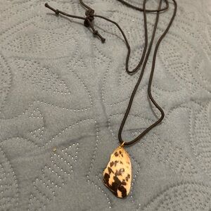 Shell necklace on black cord